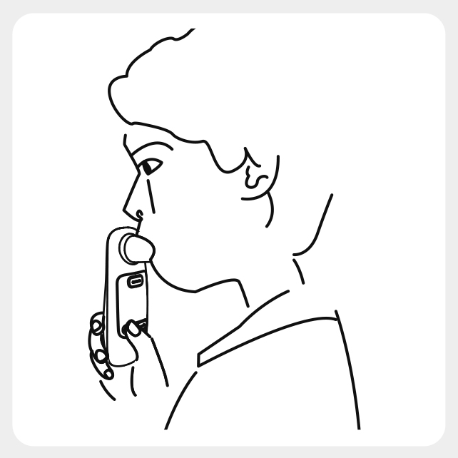 Preare to blow into the tube in the peak flow meter
